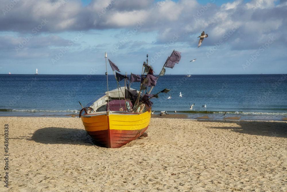 Fototapeta premium The Baltic Sea, the Polish city of Sopot and on the beach, a fishing boat 
