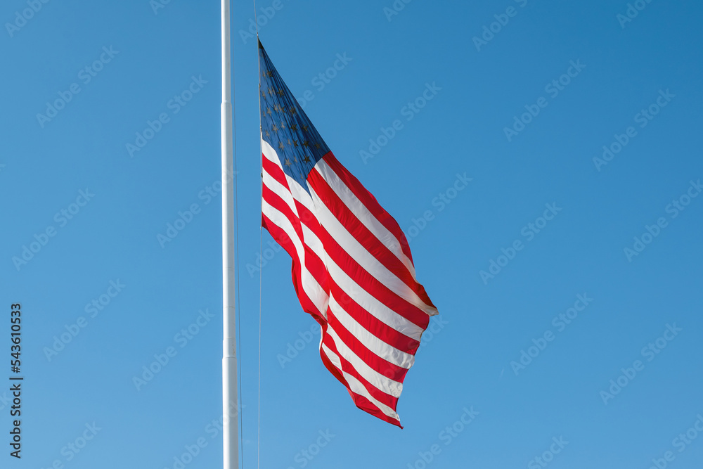 USA flag against blue sky. USA flag against blue sky.