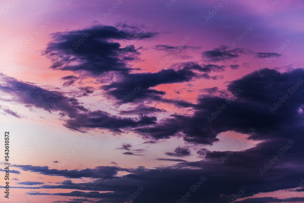 Beautiful clouds in different colors and shapes at sunset.