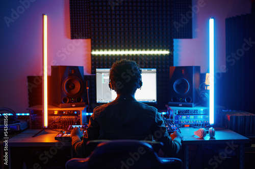 A music producer working in recording studio