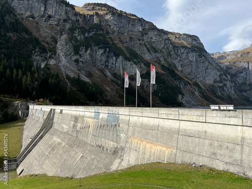 The dam Panixer or concrete dam on the reservoir lake Panixersee (Lag da Pigniu) on the slopes of the Glarus Alps mountain massif, Pigniu-Panix - Canton of Grisons, Switzerland (Schweiz) photo