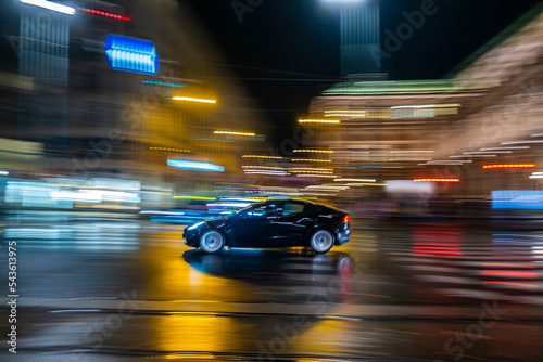 fast moving cars in the night city
