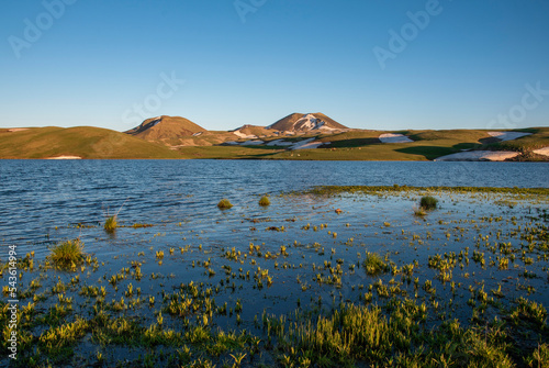 beautiful lake, Akna lake view at sunrise, 2 mountains, Kotayk, Armenia photo