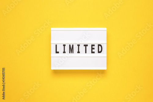 Lightbox with word limited on yellow background photo