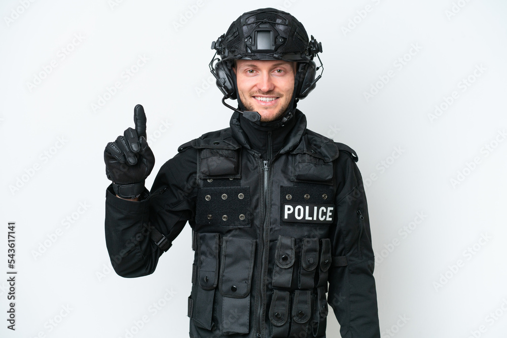 SWAT man over isolated white background showing and lifting a finger in sign of the best SWAT man over isolated white background showing and lifting a finger in sign of the best