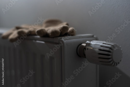 Warm gloves on the radiator. Heating season concept.