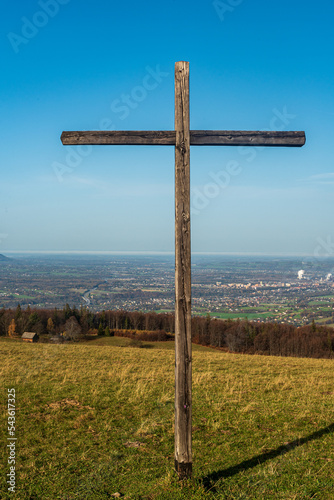 Wooden cross on Loucka hill in autumn Slezske Beskydy mountains in Czech republic