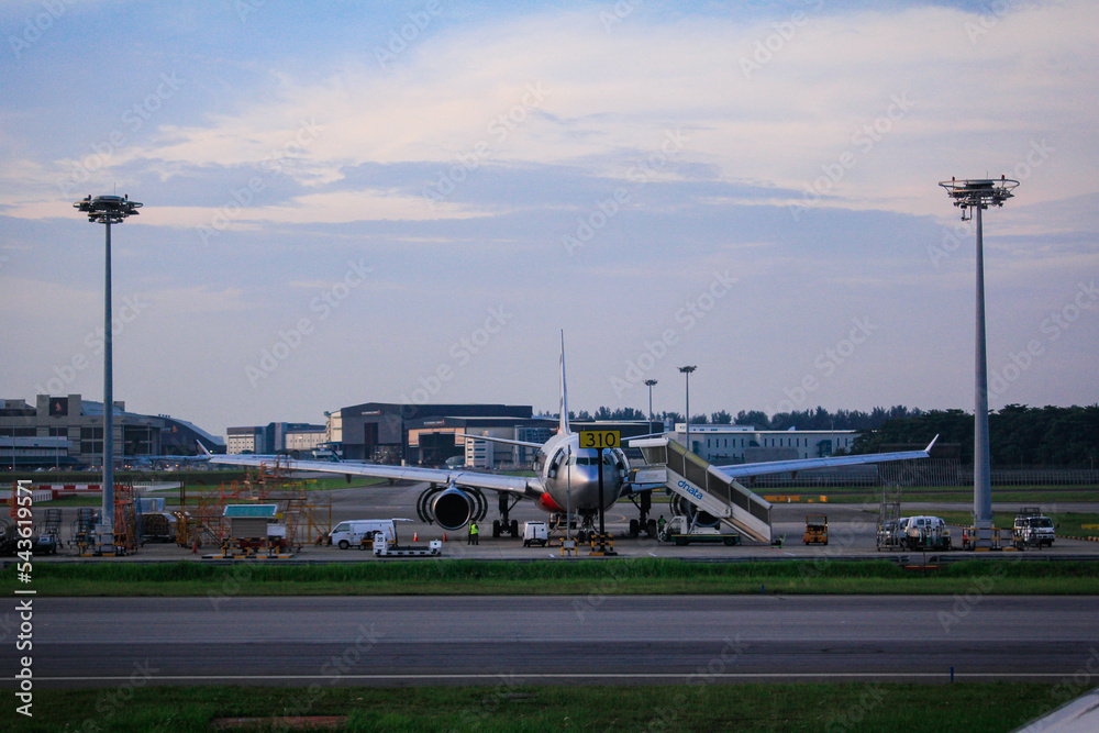 Fototapeta premium An airplane parking in the airport 