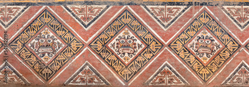 Wall mural at Huaca de la Luna (Pyramid of the Moon) with the effigy of the Moche God Ai Apaec,  Trujillo, Peru. photo