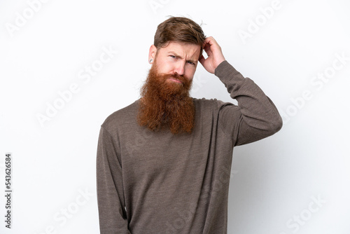 Redhead man with beard isolated on white background having doubts