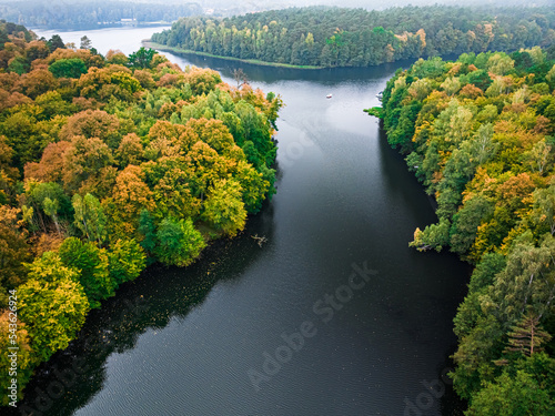 Forest and big lake in autumn, Poland, Europe.