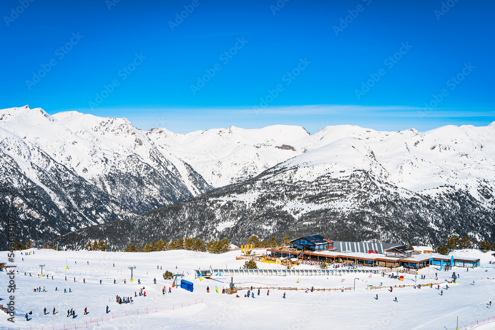 People, families, skiers and snowboarders relaxing and having fun in winter at Soldeu ski lifts cross centre, Grandvalira, Andorra, Pyrenees Mountains