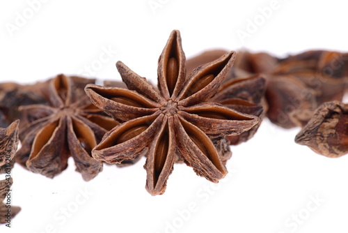 Star anise spice closeup isolated on a white background, aniseeds, christmas bakery ingredients