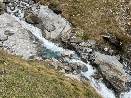 Aua dil Mer stream or Aua dil Mer creek (Aua dil Mer Bach) over the lake Panixersee (Lag da Pigniu) and in the Glarus Alps massif, Pigniu-Panix - Canton of Grisons, Switzerland (Kanton Graubünden) photo
