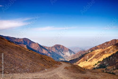 Beautiful mountain landscape in sunny weather, against the blue sky.