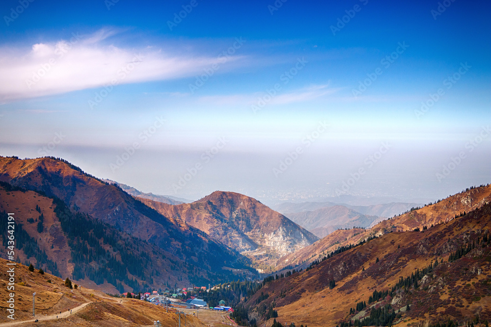 Beautiful mountain landscape in sunny weather, against the blue sky.