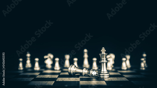 Close up king chess pieces stand with falling chess concept of team player or business team and leadership strategy or strategic planning and human resources organization risk management.