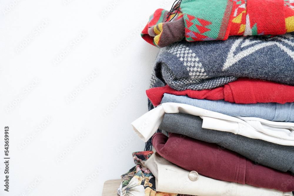 Vertical stack of fabrics on a white background