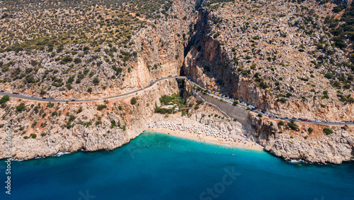 Aerial view of Kaputas beach between Kas and Kalkan, Turkey . Drone view of beach with beautiful,clear turquoise waters of the Mediterranean Sea. Popular and famous place for tourists photo