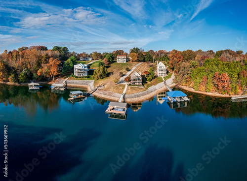 High resolution aerial view panorama of lakefront homes, boat docks and beautiful autumn colorful foliage on Tims Ford Lake in Tennessee.