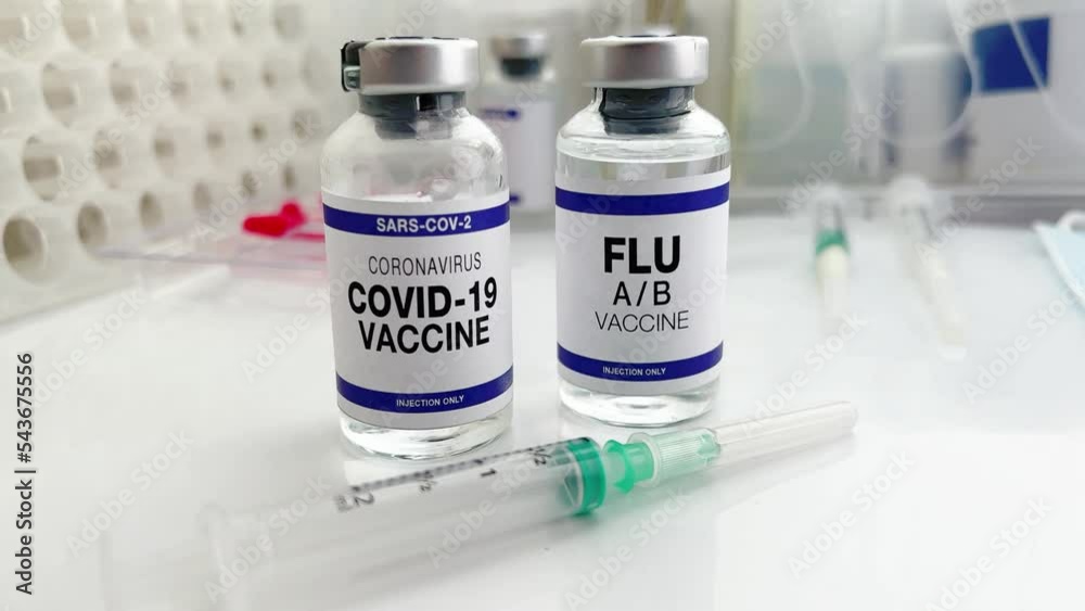 Flu A/B and Covid-19 vaccine vials for booster shot for omicron and Influenza virus. Coronavirus and Flu Shot vaccine bottles for vaccination of new variants of Sars-cov-2 virus and Influenza A Flu A/B and Covid-19 vaccine vials for booster shot for omicron and Influenza virus. Coronavirus and Flu Shot vaccine bottles for vaccination of new variants of Sars-cov-2 virus and Influenza A