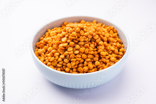 Fried and Spicy Chana Dal Masala namkeen is a popular Chakna recipe. served in a bowl photo