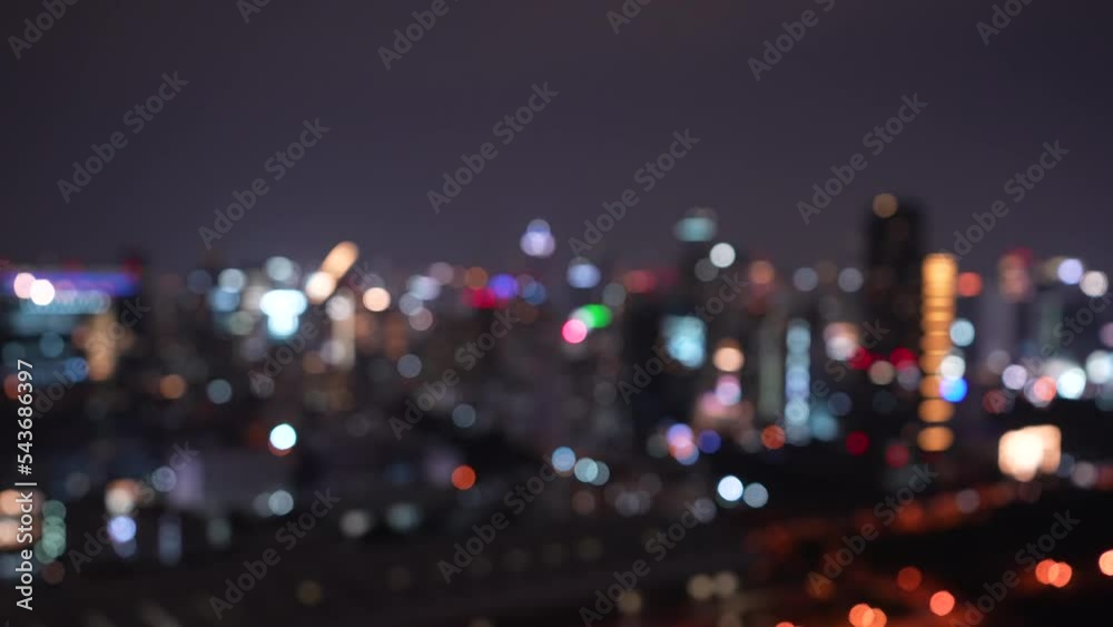night cityscape view with skyscrapers lights bokeh defocused background. Bokeh blurred traffic on highway road at night. horizontal 4k height resolutions 2160 x 3840 night cityscape view with skyscrapers lights bokeh defocused background. Bokeh blurred traffic on highway road at night. horizontal 4k height resolutions 2160 x 3840