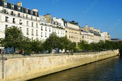 Paris, France - Beautiful old French buildings overlooking the Seine river on a beautiful day with a clear blue sky. Image has copy space.