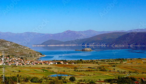 picture of a lake Prespa in Albania and island Maligrad in autumn