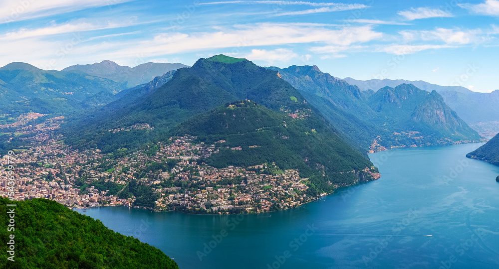 Spectacular panoramic view over the city of Lugano, the Lugano Lake and Swiss Alps, visible from Monte San Salvatore observation terrace, canton of Ticino, Switzerland.