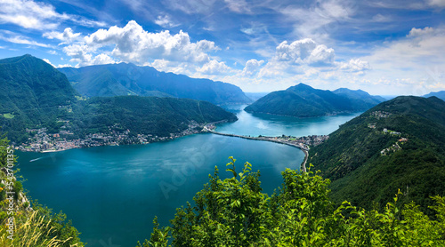 Spectacular panoramic view over the city of Lugano, the Lugano Lake and Swiss Alps, visible from Monte San Salvatore observation terrace, canton of Ticino, Switzerland. photo