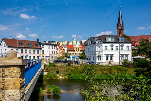 Historical city of Stassfurt withe the river Bode in front, Germany  photo