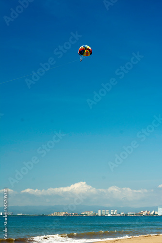 Man enjoying coastline view on parachute tour