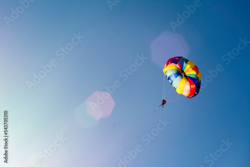 Man enjoying coastline view on parachute tour