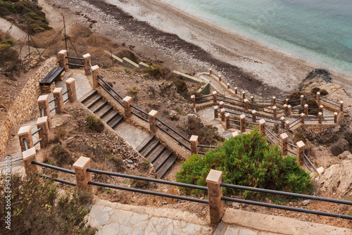 Stairs down to the nudist beach La Joya, in Torrenueva Costa, Granada, long and quite steep stairs until you reach the cove. Costa Tropical. photo