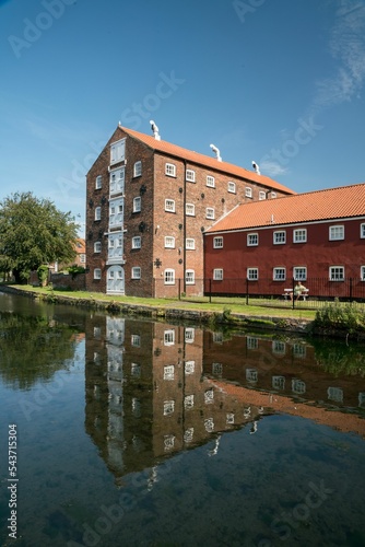 Vertical shot of the Victorian Warehouses on the Driffield Navigation Canal, Yorkshire photo