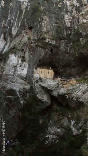 
Ermita en la Cueva de la Virgen de Covadonga con fieles. Asturias. España photo