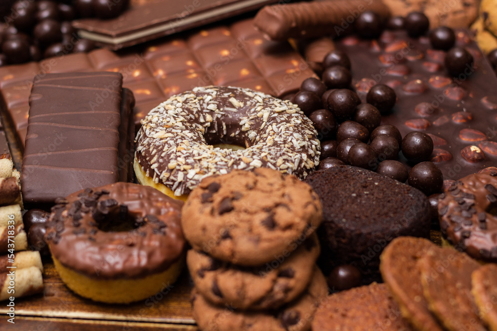 Beautiful chocolate, doughnuts, chocolate stick, and chocolate chip cookies background Beautiful chocolate, doughnuts, chocolate stick, and chocolate chip cookies background