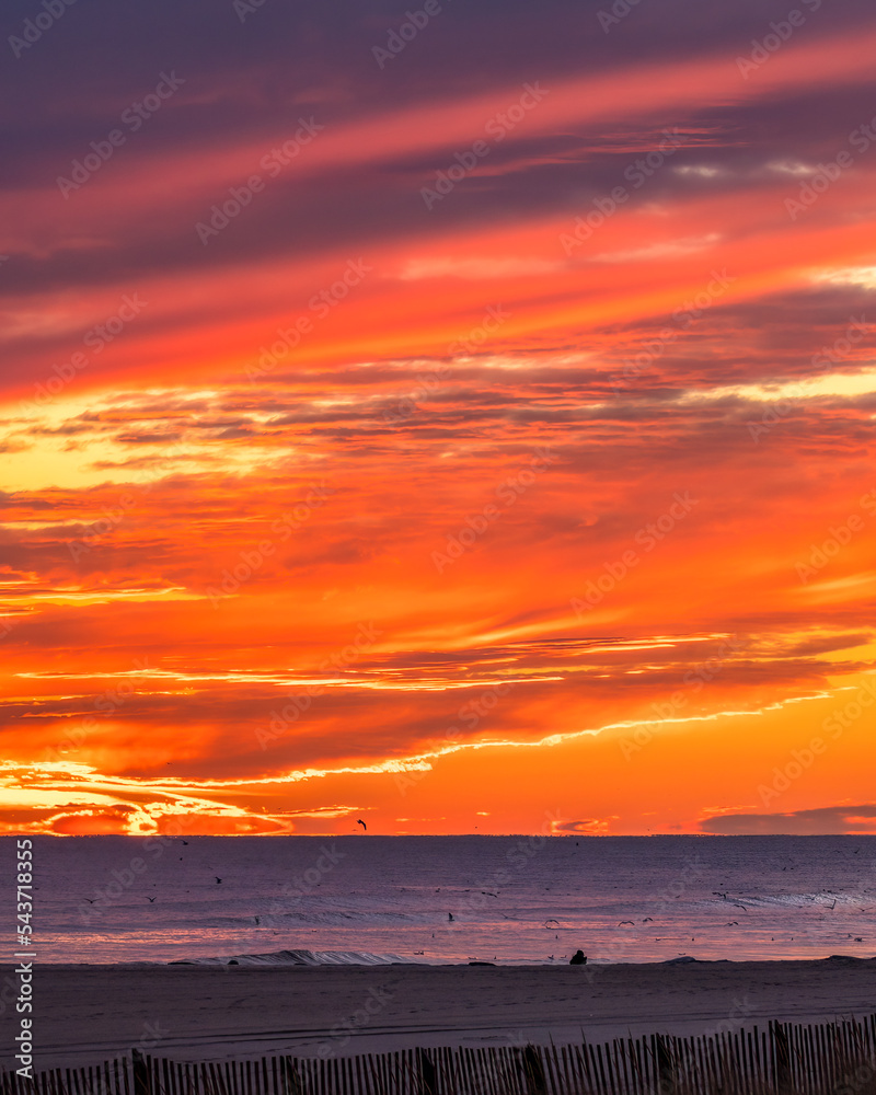 Vibrant colorful sunset glow over the beach. Long Beach, Long Island New York Vibrant colorful sunset glow over the beach. Long Beach, Long Island New York