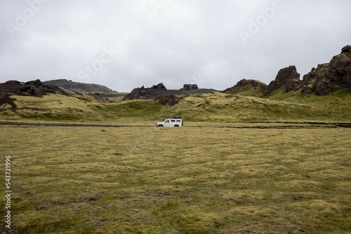 White Jeep on the mossy rocks in Katla Geopark photo