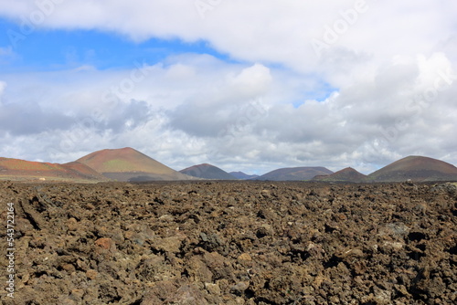 vulcanic landscape with vulcanos and craters on lanzarote, canary islands, spain