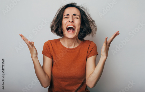 Fotobehang Close up shot of screaming crazy frustrated woman with anxiety, anger and depression