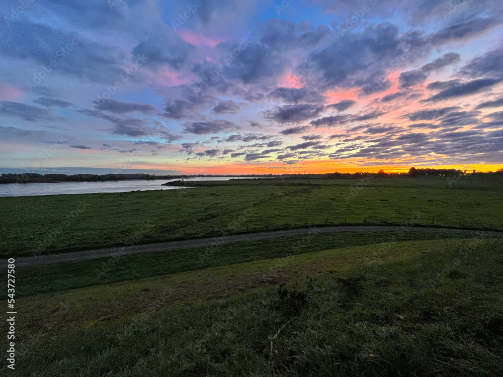 Obraz premium Amazing sunrise in Nederland in autumn day