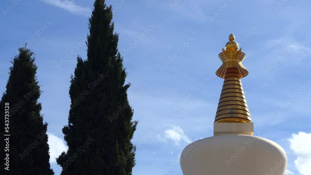 Stupa and pine tree on blue sky Benalmadena Stupa is the tallest stupa