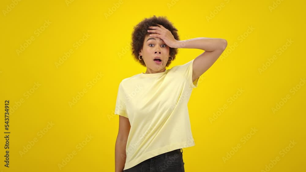 Bored kinky-haired African American woman rubs face tiredly Bored kinky-haired African American woman rubs face tiredly