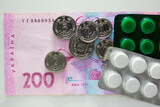Ukrainian currency with pills and kopecks close-up
