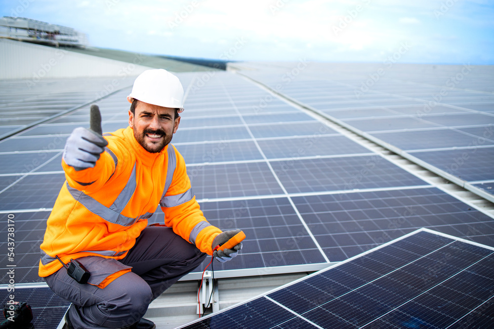 Installation of solar panels and professional worker holding thumbs up. Installation of solar panels and professional worker holding thumbs up.