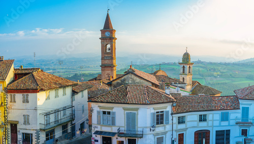 Early winter panorama of the village of Govone, over Langhe hills (Cuneo province, Piedmont, Italy). This area is world famous for its valuable wines and is UNESCO Site since 2014.
