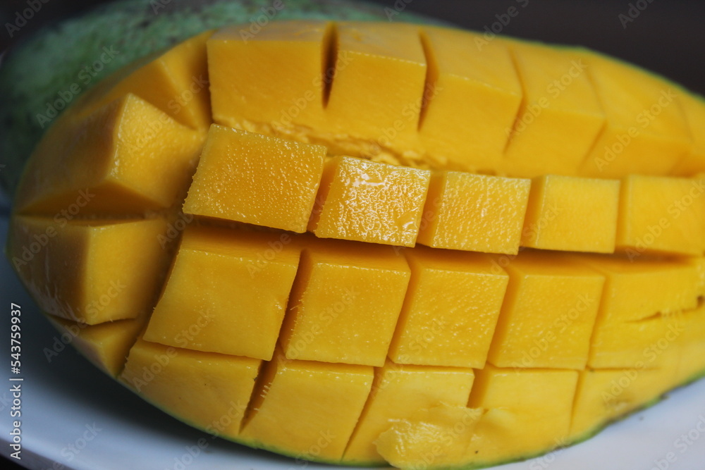 mango sliced in squares on a plate mango sliced in squares on a plate