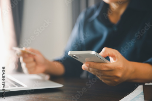 Woman hands of using online virtual app on mobile phone. Millennial guy chatting on smartphone, using banking services, reading text message, typing, shopping, making call, browsing internet.Close up